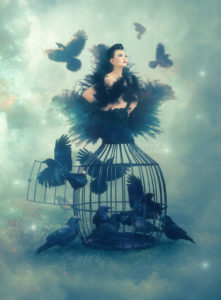 girl in a cage with birds